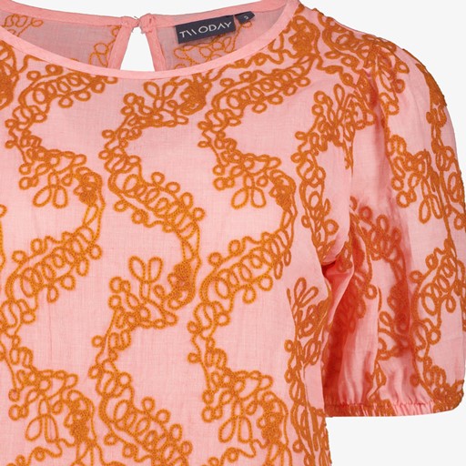Dames top met oranje borduursels