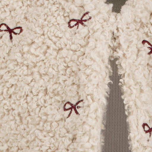 Fluffy meisjes gilet met strikjes beige