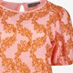 Dames top met oranje borduursels
