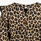Meisjes jurk met panterprint en ruches beige