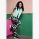 Flared dames broek met bloemenprint groen wit